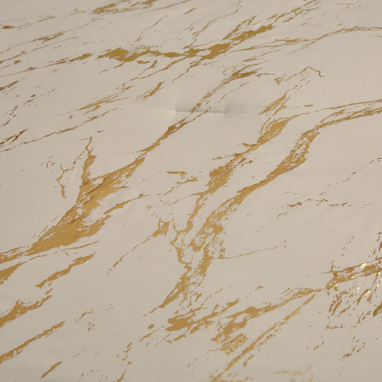 Close-up of marbled pattern fabric on Coastal Drift apricot Comforter Bundle – Breezy 3‑Piece Bedding with beige and gold tones