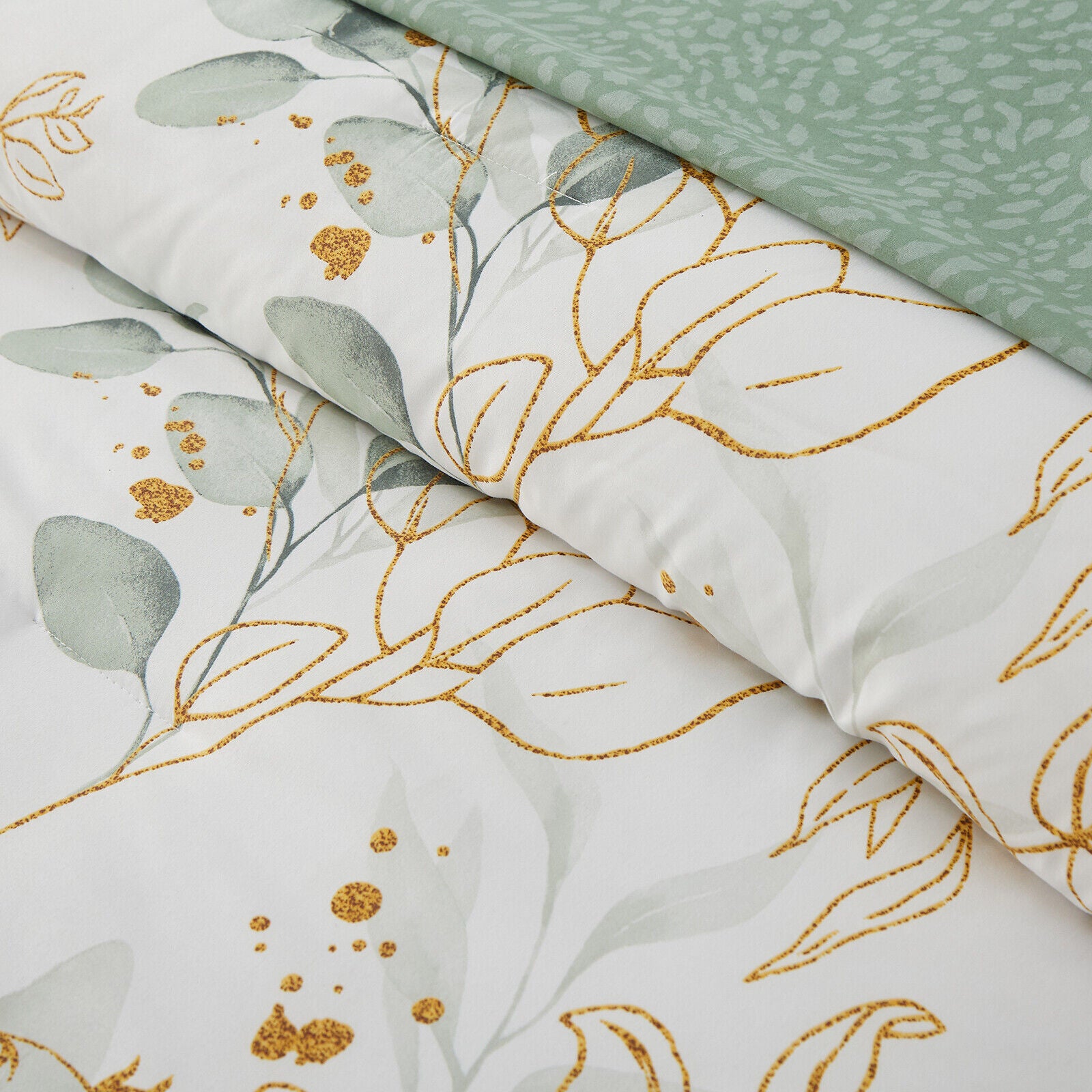 Soft Leaves Comforter Set, King Size, Plush Quilted Bedding with Pillowcases featuring green and gold leaf pattern close-up detail