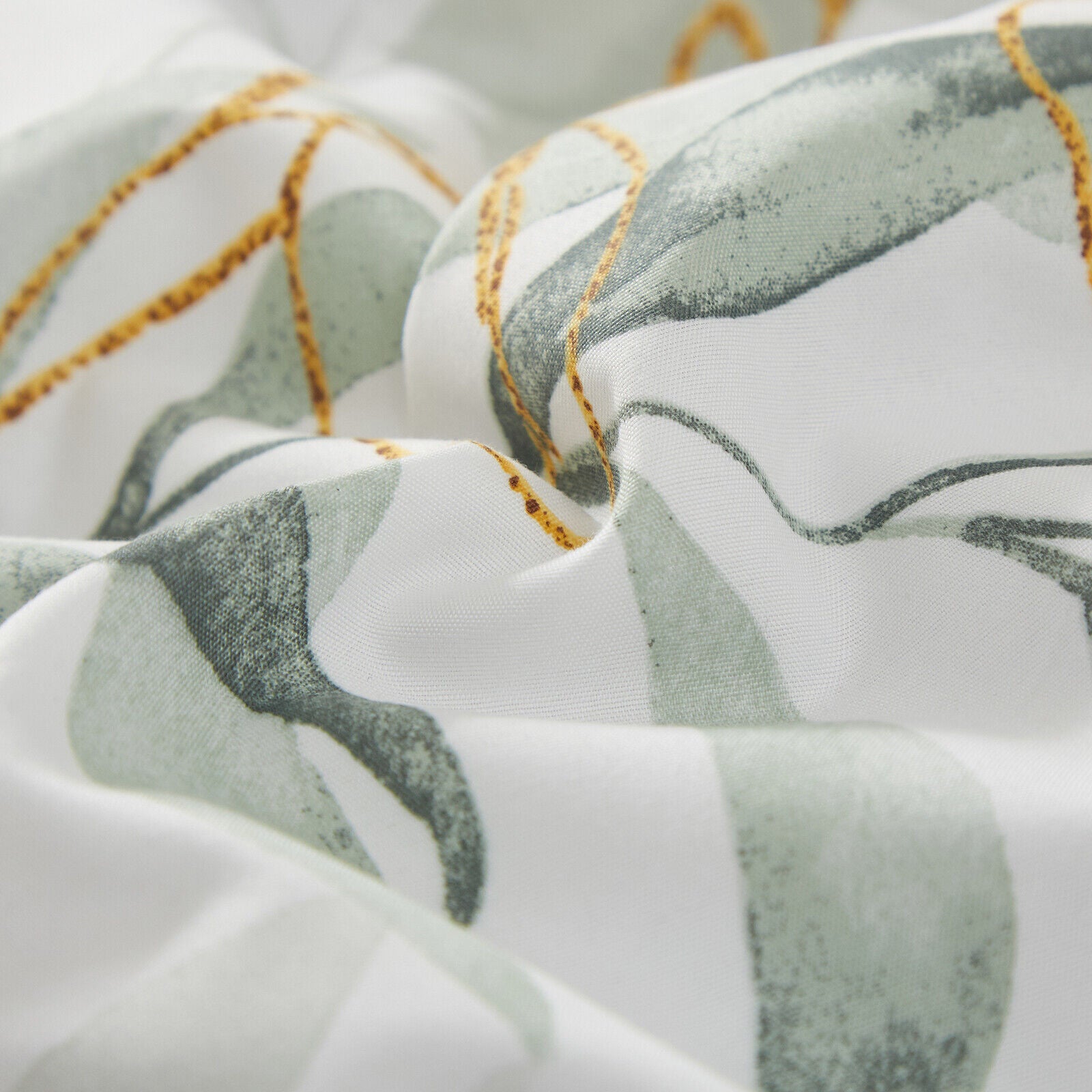 Soft Leaves Comforter Set, King Size, Plush Quilted Bedding with Pillowcases featuring green leaf pattern on white fabric close-up