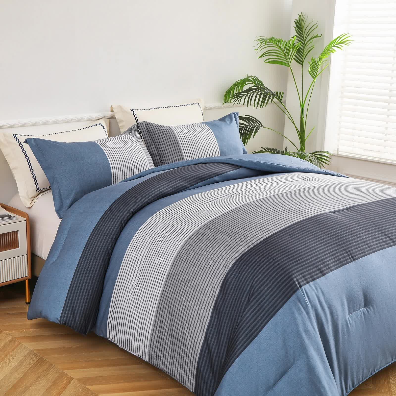 Coastal Drift striped Comforter Bundle – Breezy 3‑Piece Bedding with blue and gray stripes on a bed in a bright bedroom