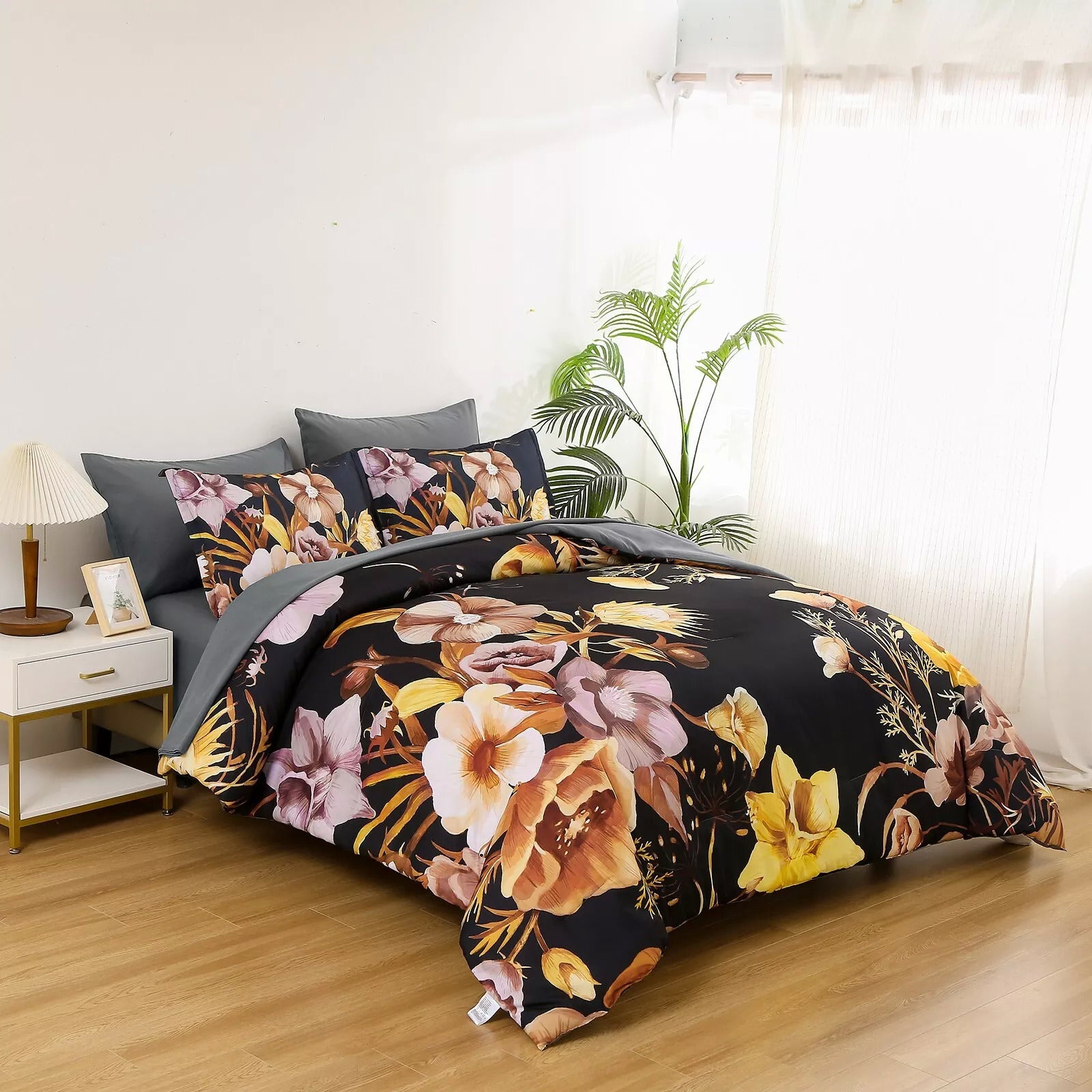 Soft Floral Leaf Comforter Set, King Size, Quilted Bedding with Pillowcases featuring floral design on black in modern bedroom setting