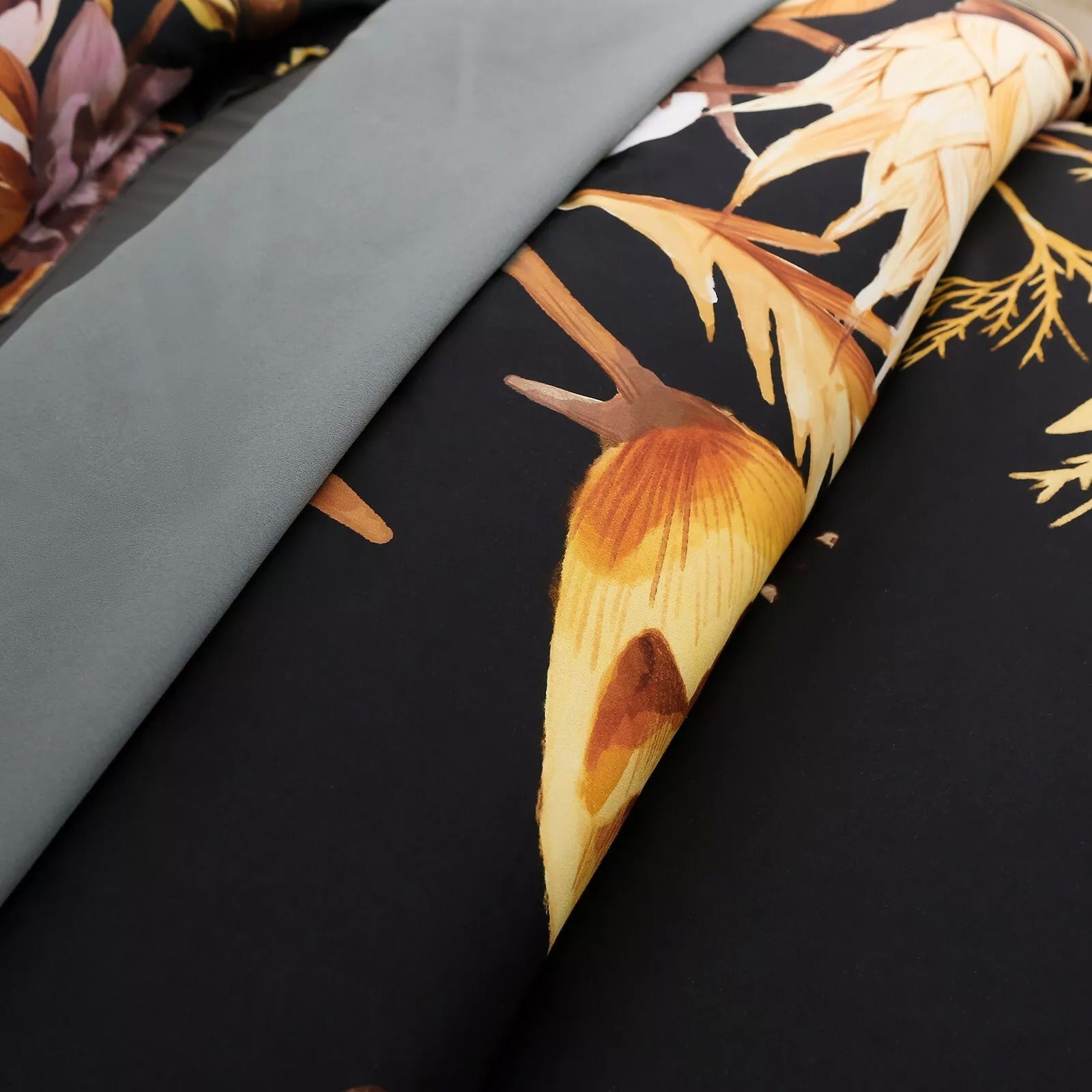 Soft Floral Leaf Comforter Set, King Size, Quilted Bedding with Pillowcases featuring black background and muted floral design detail