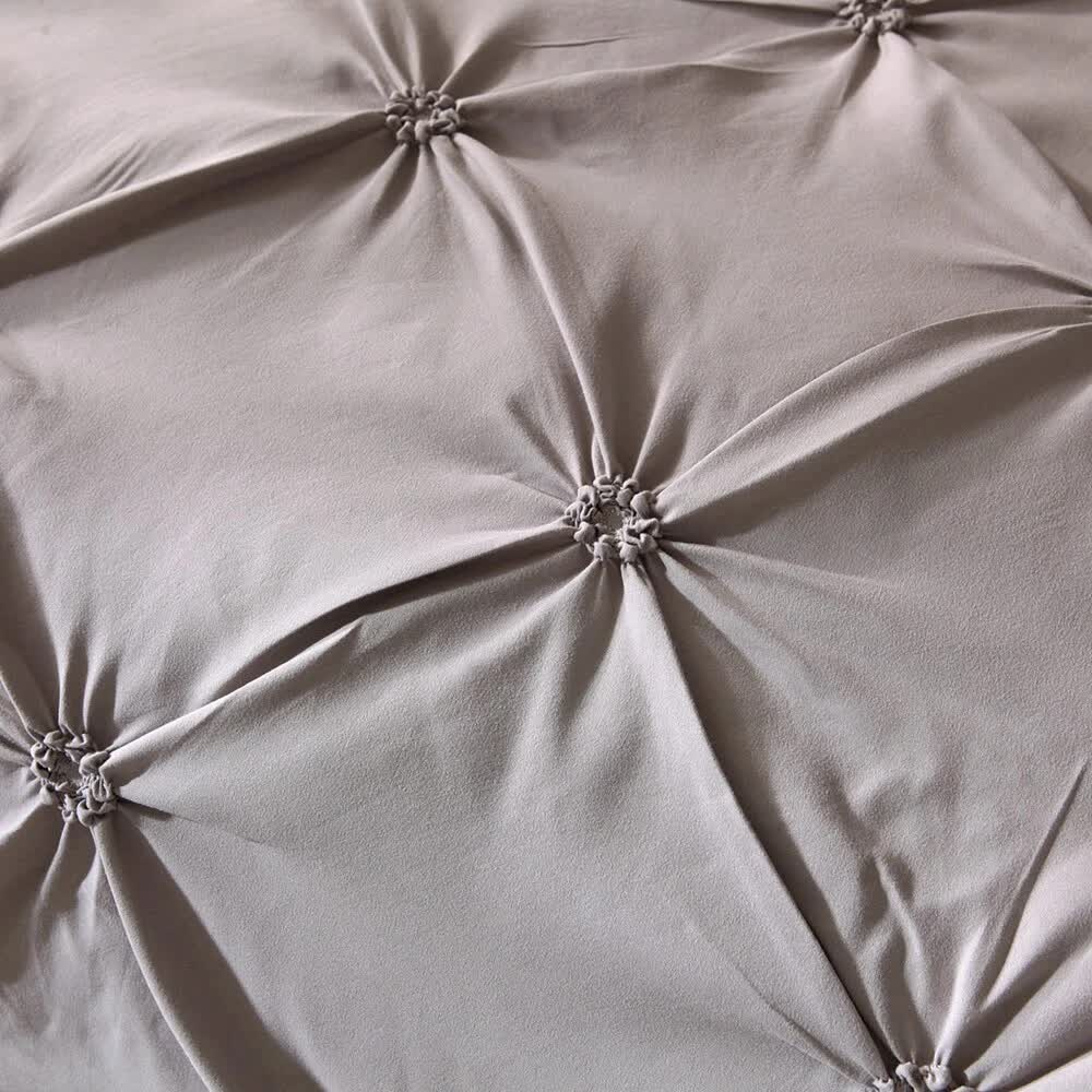 Close-up of taupe fabric with gathered tufted details from Chill Vibe Bedding Set – 3‑Piece Comforter with Pillow Shams