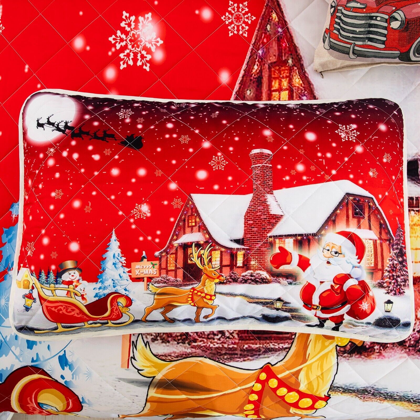 Holiday Cheer Christmas Queen Bedspread Set pillow with Santa, sleigh, reindeer, and snowy festive cabin scene on red background