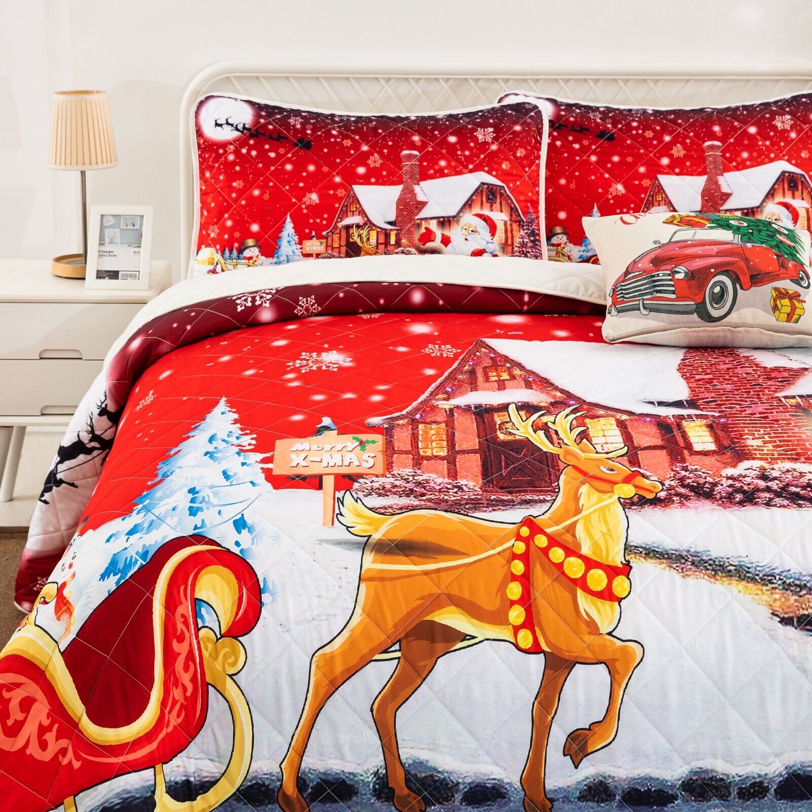 Holiday Cheer Christmas Queen Bedspread Set with festive reindeer, sleigh, and snowy cabin design on quilt and pillows.