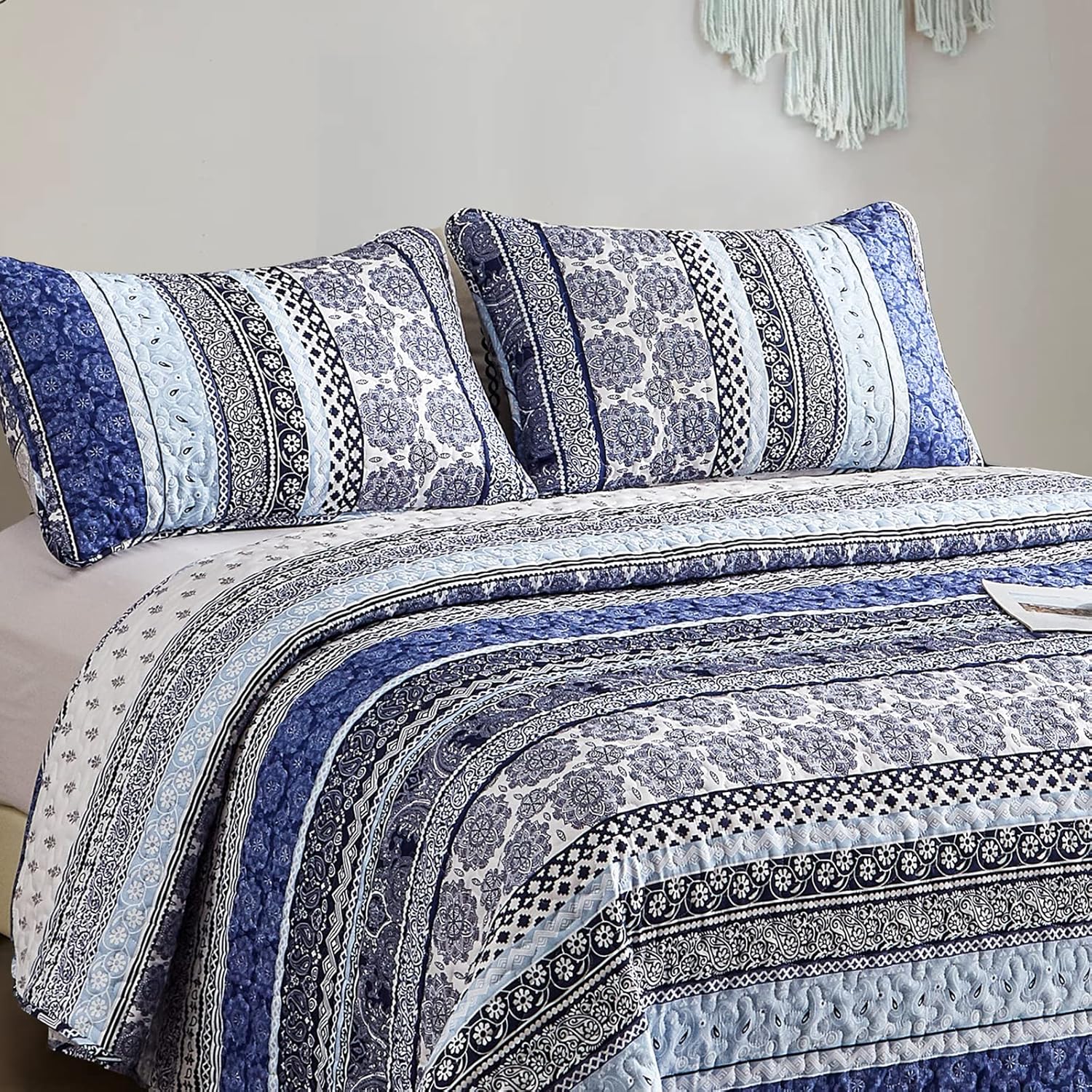 Sophisticated Quilted Coverlet and Pillowcases Set: A Timeless Addition - Queen size with blue patterned quilt and matching pillows on bed