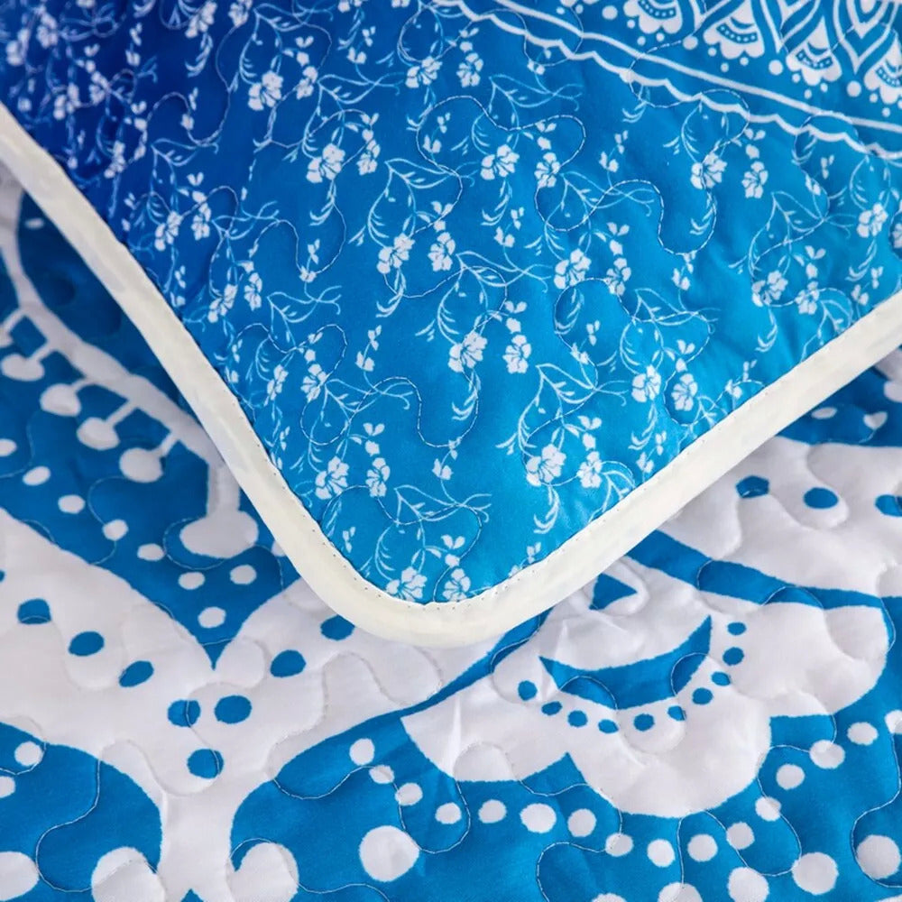 Close-up of blue and white floral quilted fabric from Xciting Quilted bedspread and pillowcovers set: Add Some Fun - Queen size