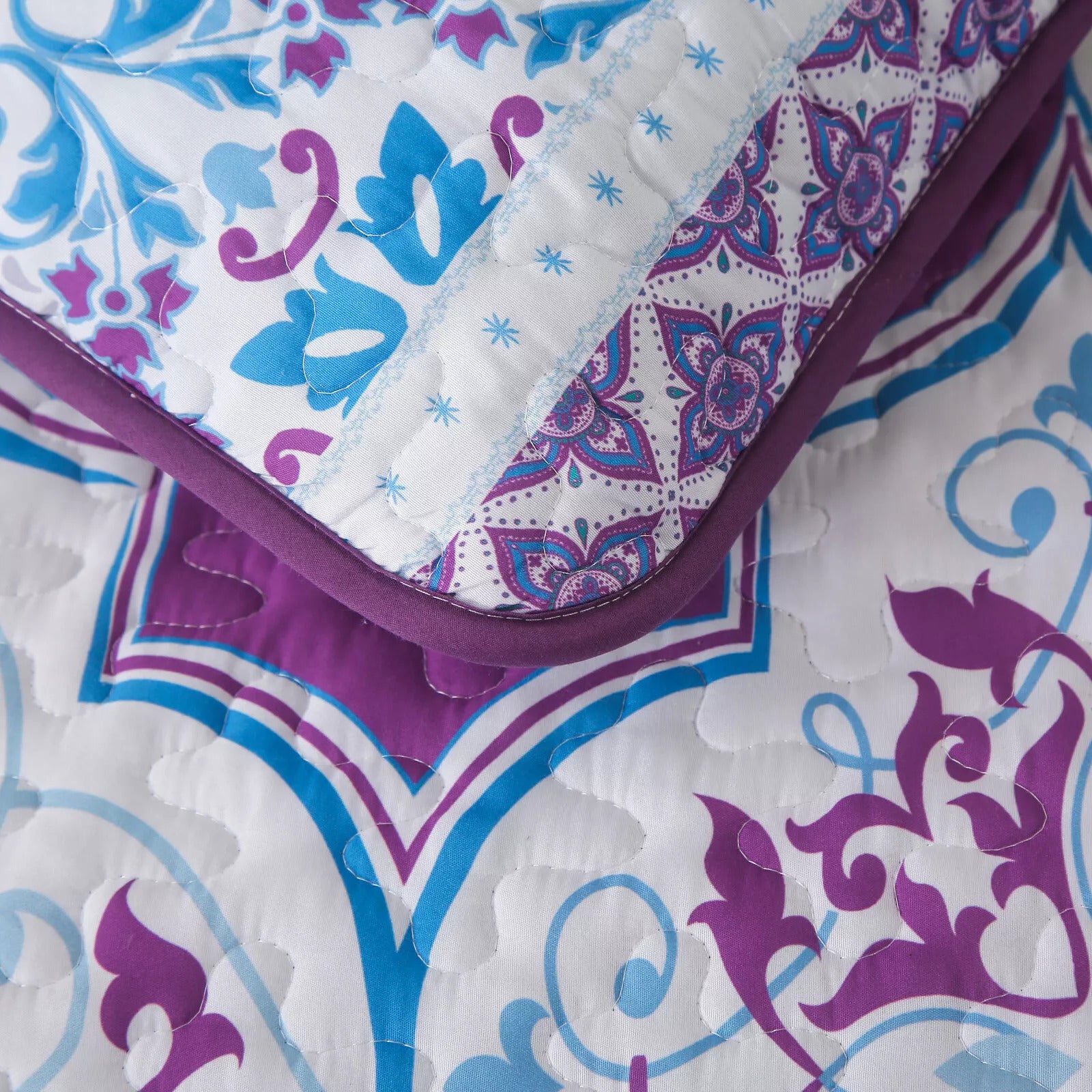 Handsome Quilted Bedspread and Pillowcases Set: Strong, Sturdy, and Stylish - Queen size with purple and blue floral pattern close-up
