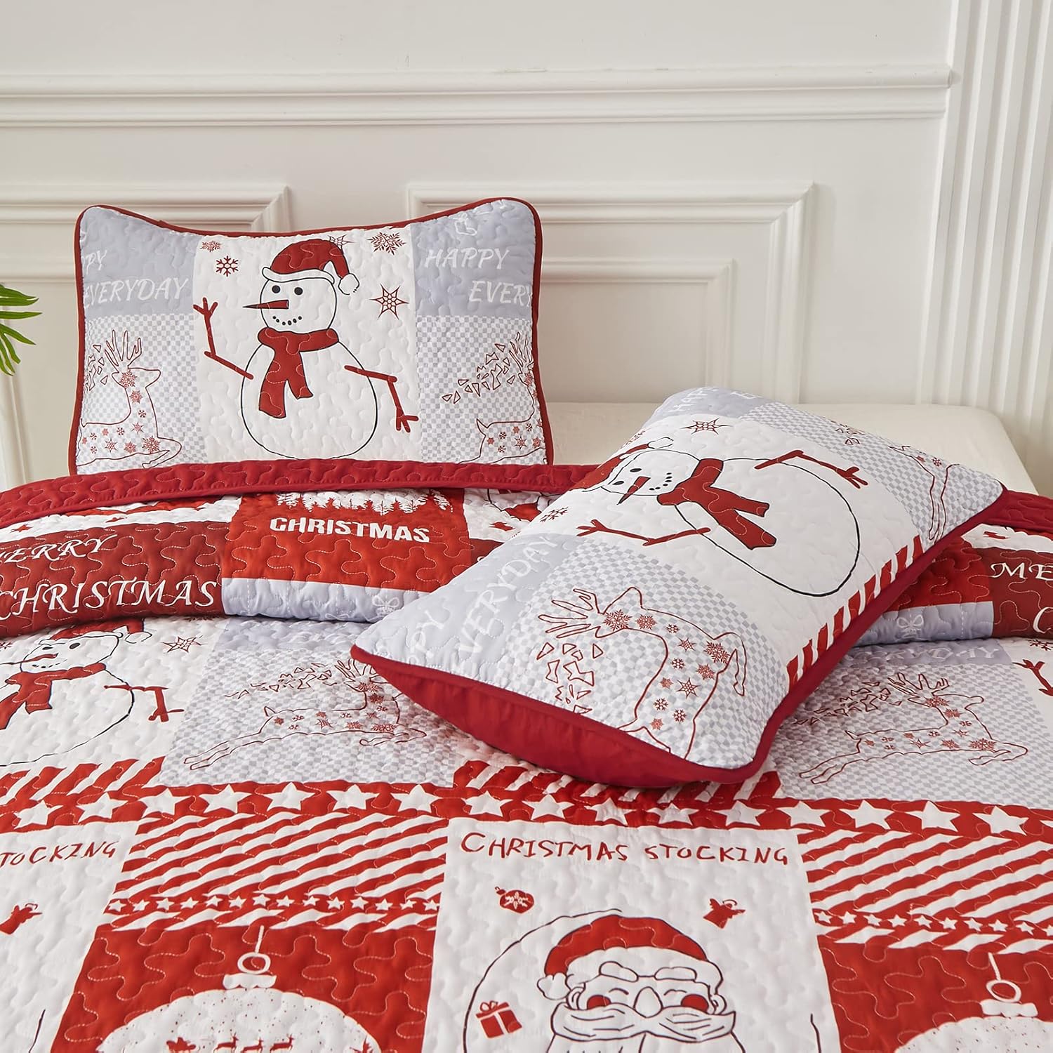 Winter Wonderland snowman santa Christmas Queen Bedspread Set with festive quilt and matching pillow shams on a bed