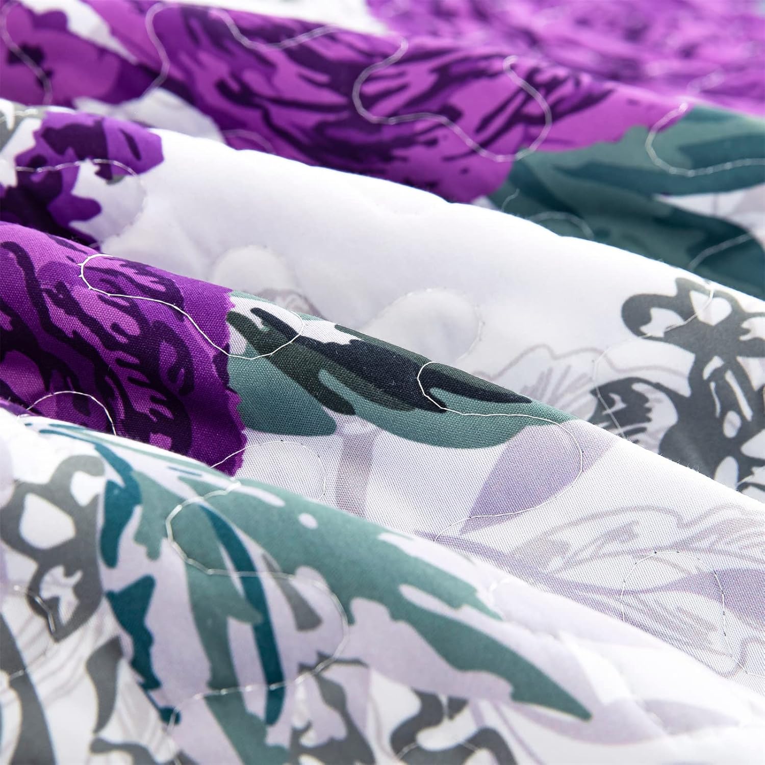 Close-up of Eclectic Quilted coverlet and pillowcovers set: Add Unique Flair - Queen size with purple, green, and white floral pattern