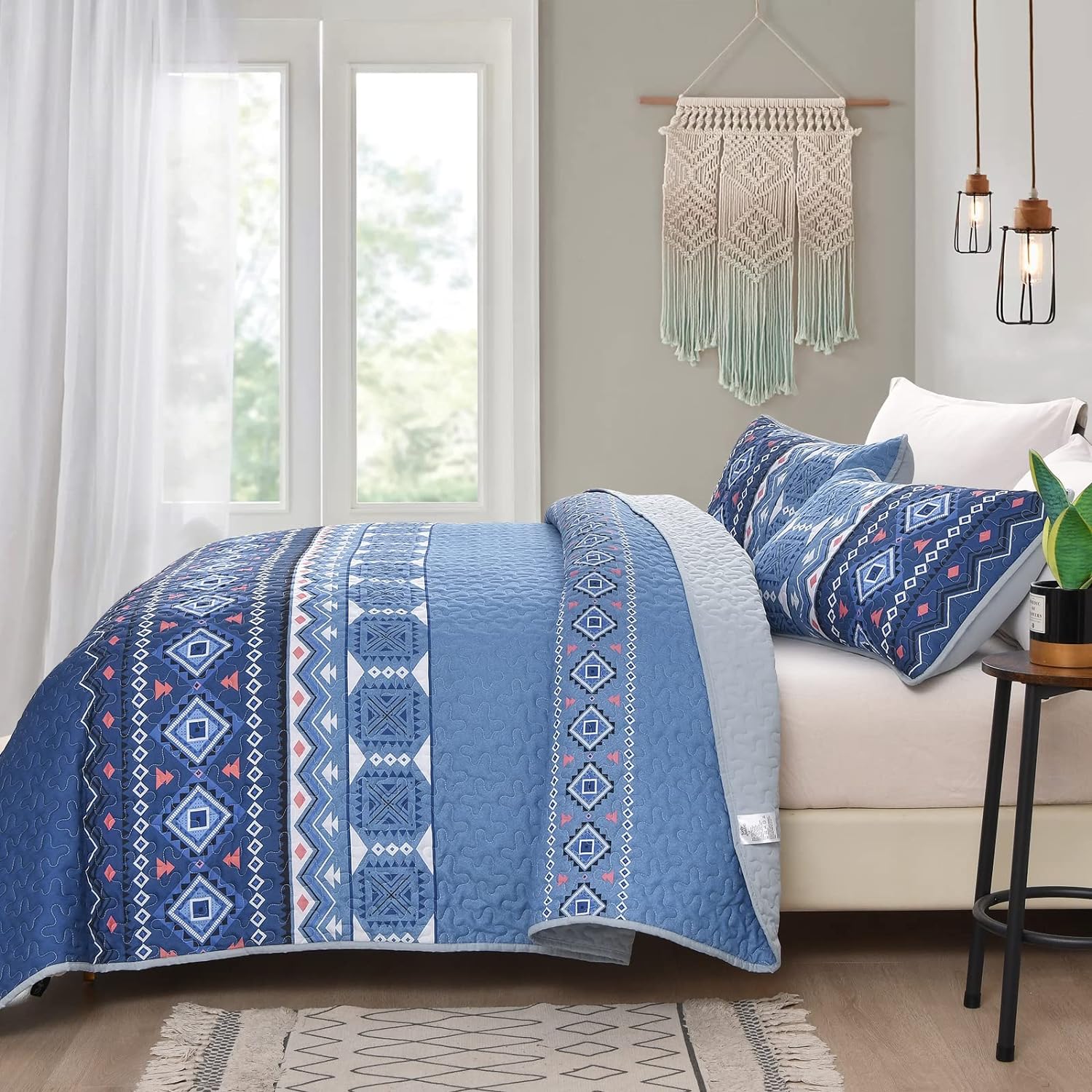 Nature Lover's Quilted bedspread and pillowcovers set: Inspired by the Outdoors - Queen size on bed with blue geometric patterns in bedroom
