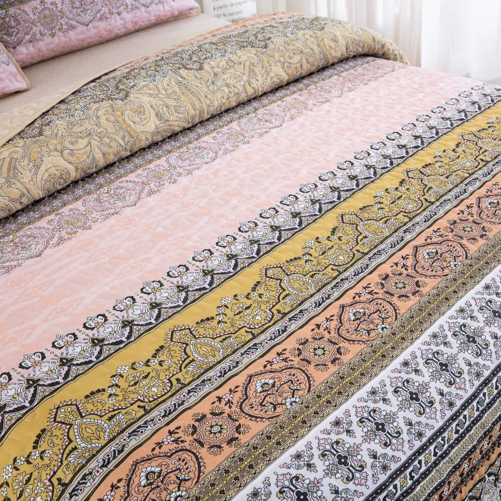Crafted Quilted Bedspread and Pillowcases Set: A Testament to Skilled Craftsmanship - Queen size with intricate patterned design on bed.