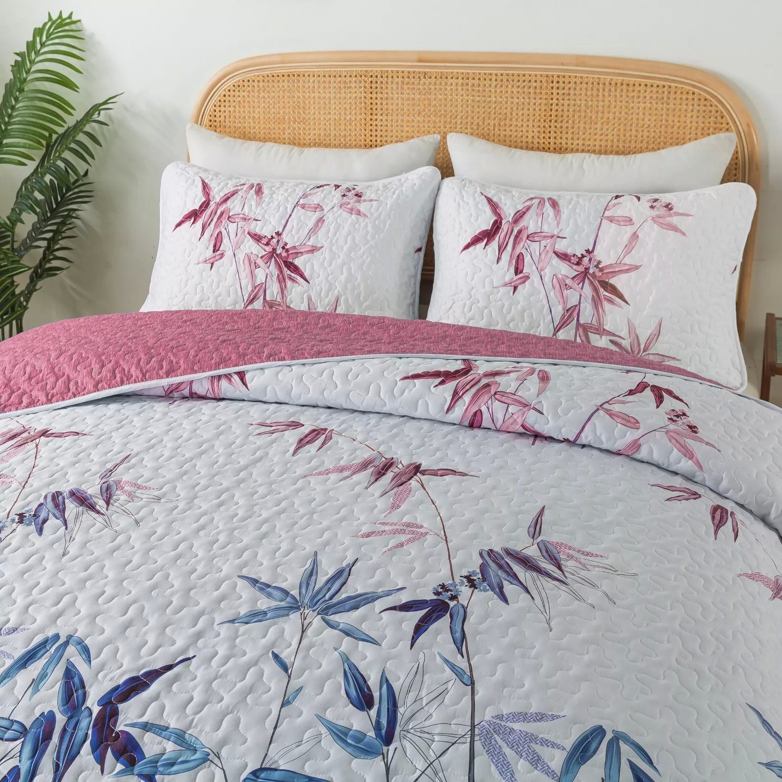 Floral Quilted bedspread and pillowcovers set: Embrace Nature Indoors - Queen size in white with pink and blue botanical design on bedzy bed