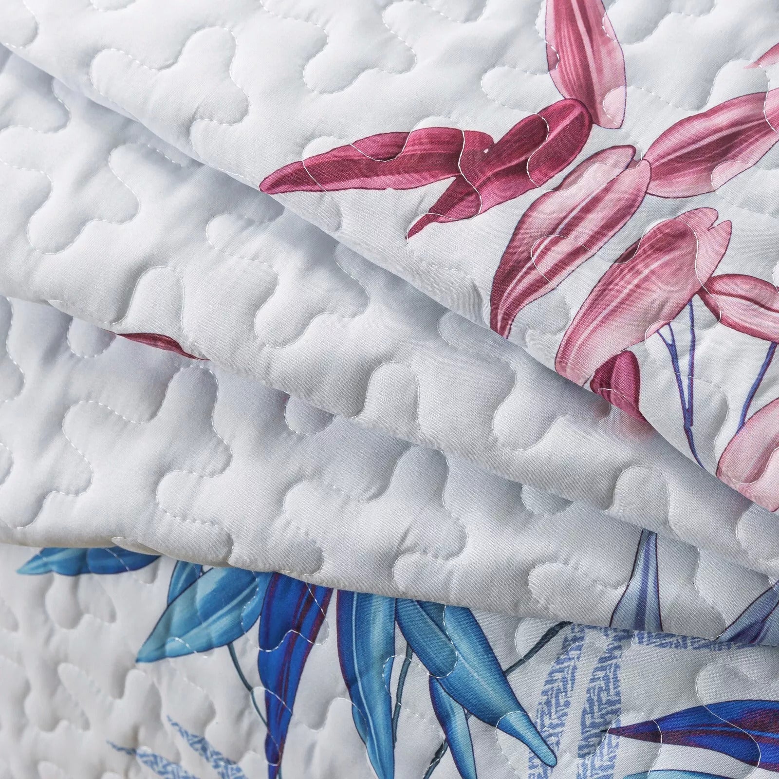 Close-up of Floral Quilted bedspread and pillowcovers set: Embrace Nature Indoors - Queen size with detailed stitching and botanical print
