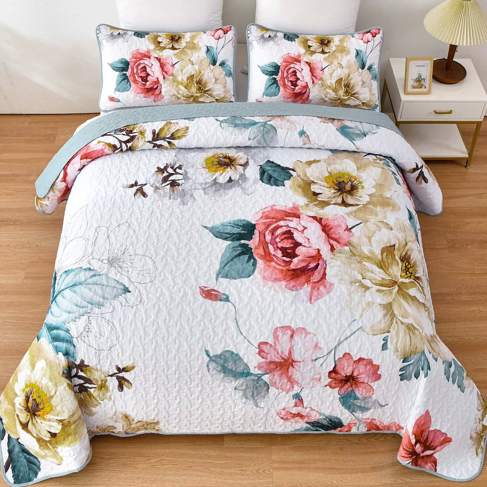 Vibrant Quilted Bedspread and Pillowcases Set: Add Color and Comfort to Your Space - Queen size with floral design on bed in bedroom