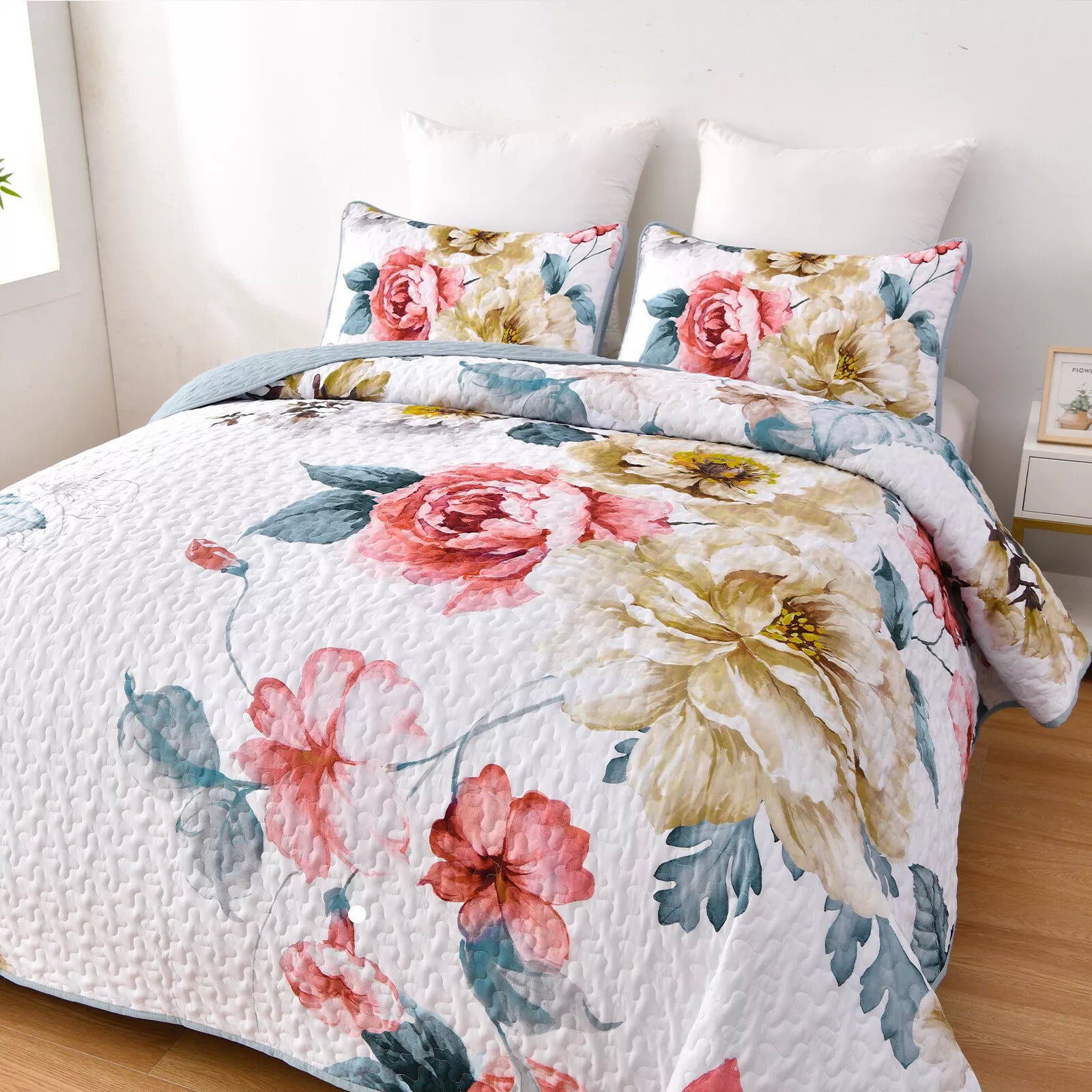 Vibrant Quilted Bedspread and Pillowcases Set: Add Color and Comfort to Your Space - Queen size with floral pattern on bed in bright room