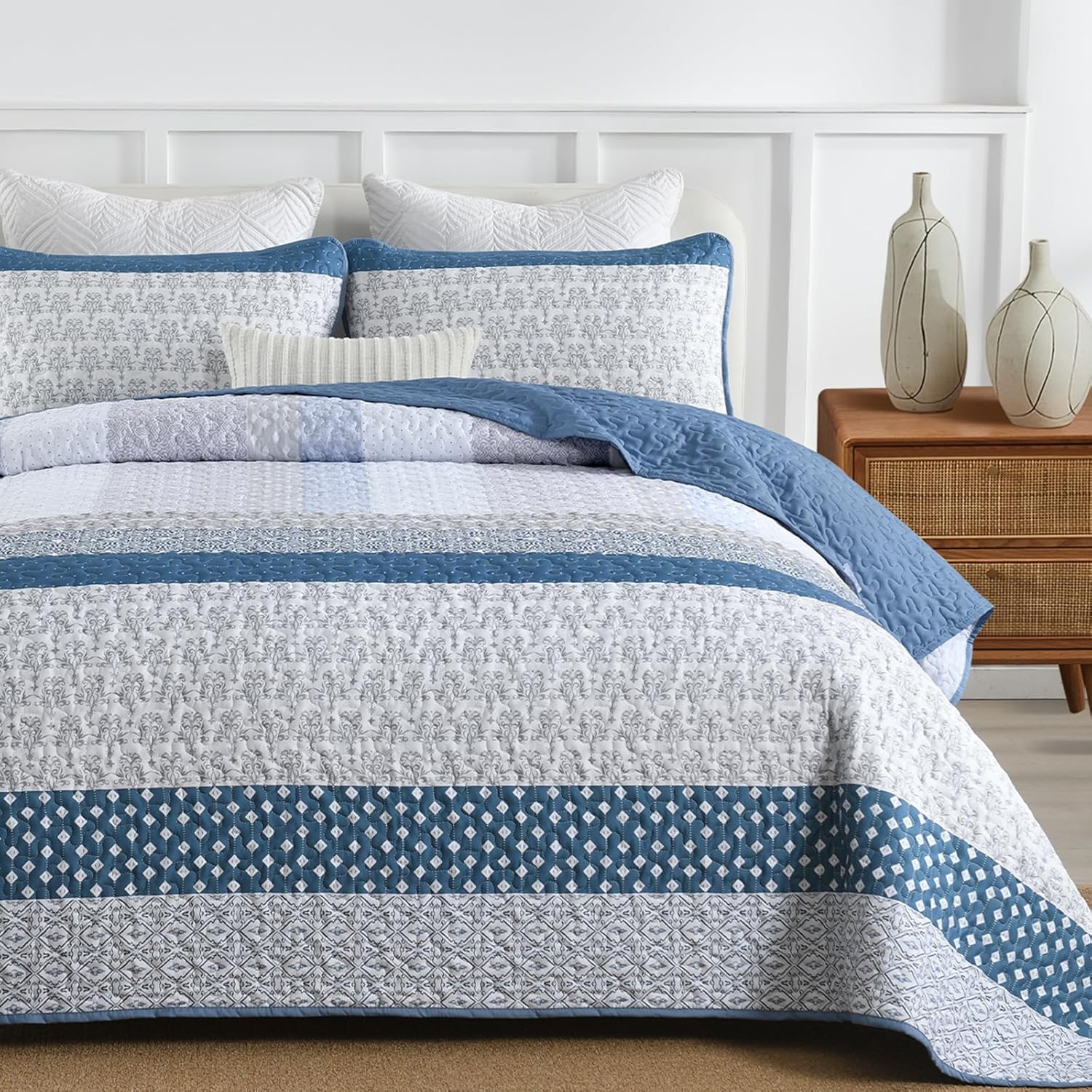 Dazzling Quilted bedspread and pillowcovers set: Add Sparkle to Your Space - Queen size with blue and white pattern on a styled bed