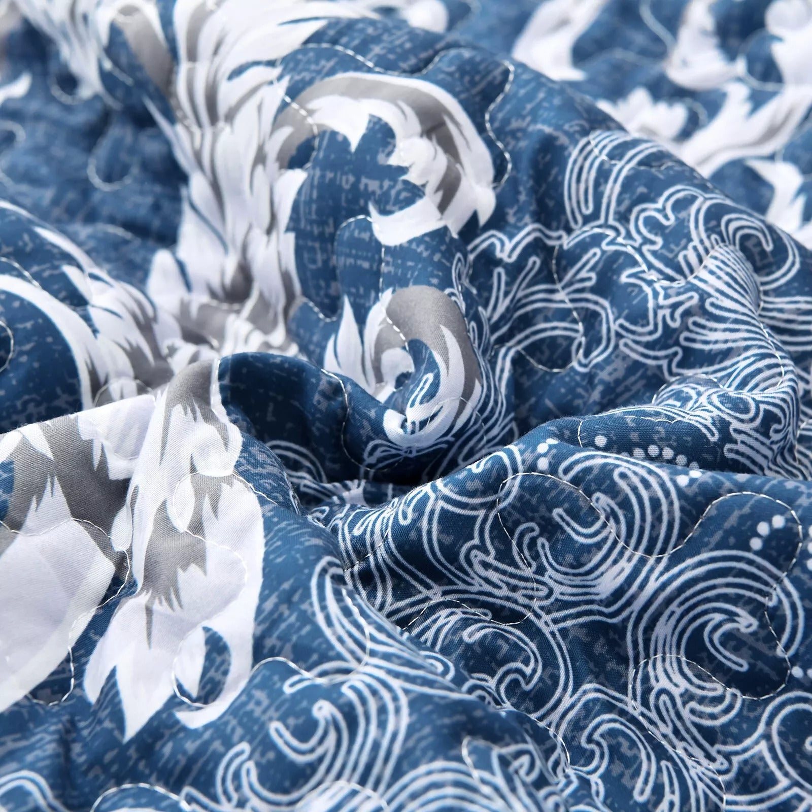Close-up of patterned fabric in blue and white from Alluring Quilted bedspread and pillowcovers set: Luxurious Bedroom Addition - Queen size
