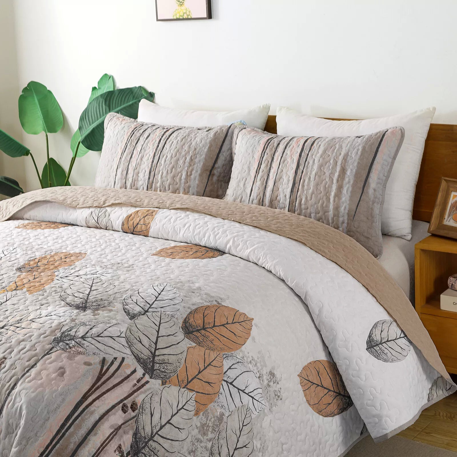 Kaleidoscope Quilted bedspread and pillowcovers set: Vibrant and Fun - Queen size with leaf pattern on bed in bright bedroom