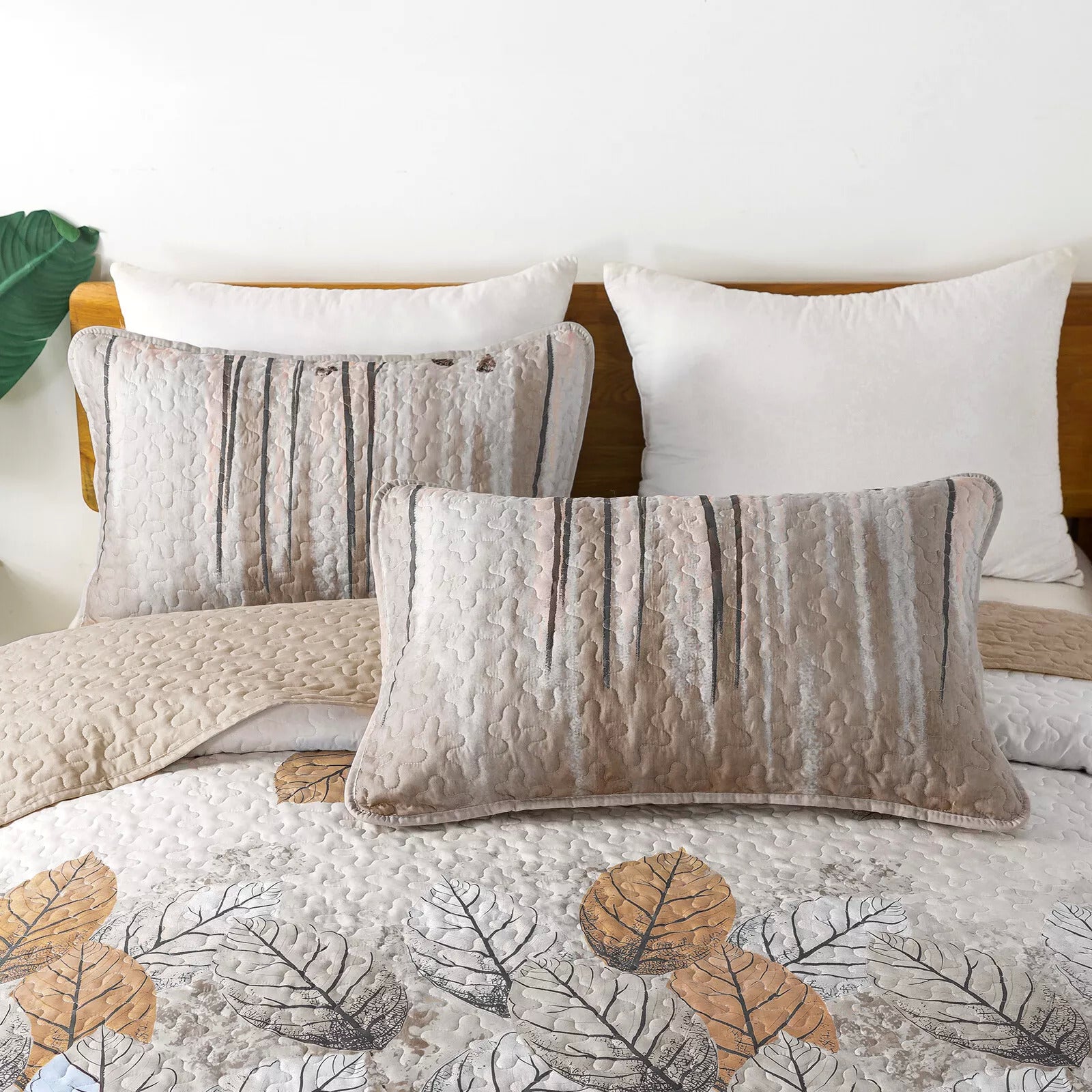 Kaleidoscope Quilted bedspread and pillowcovers set: Vibrant and Fun - Queen size with leaf print and textured pillows on bed