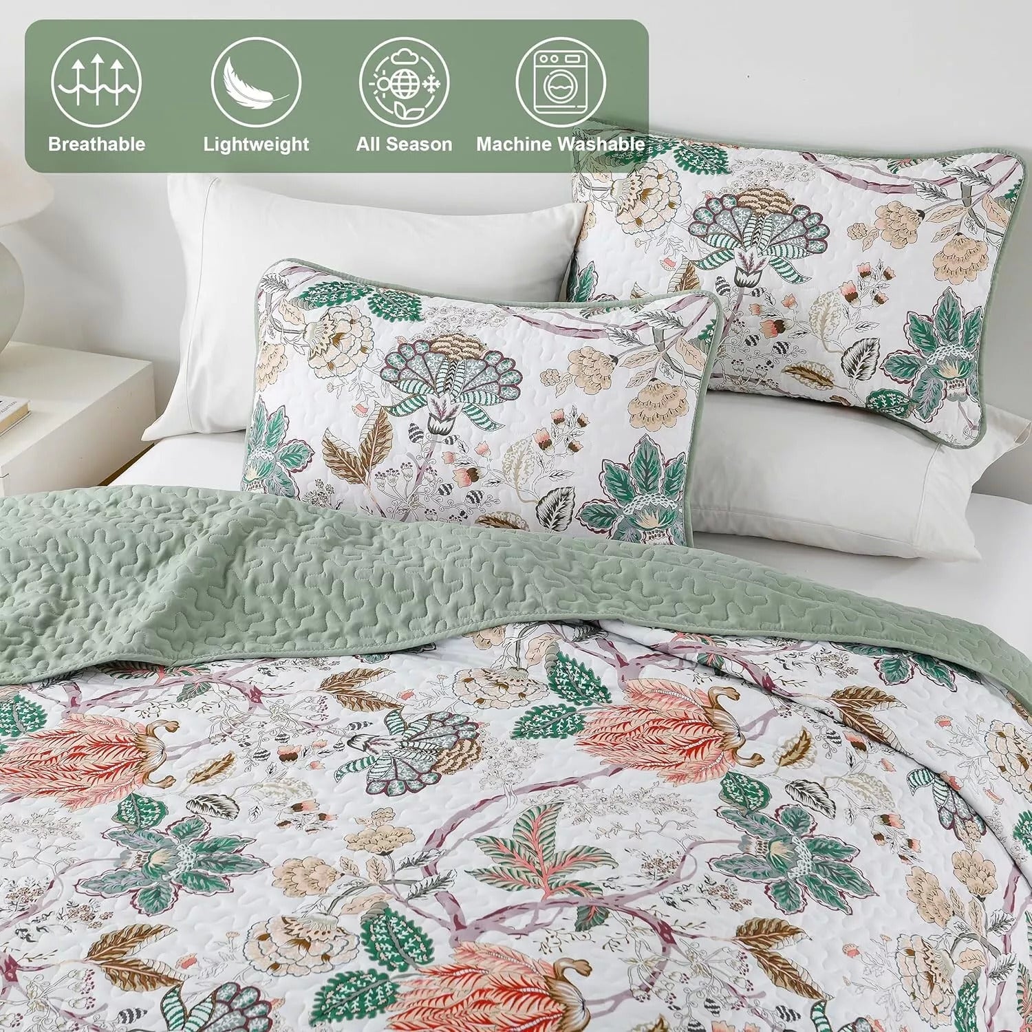 Understated Quilted coverlet and pillowcovers set: Subtle Elegance - Queen size with floral pattern and reversible green quilt on bed.