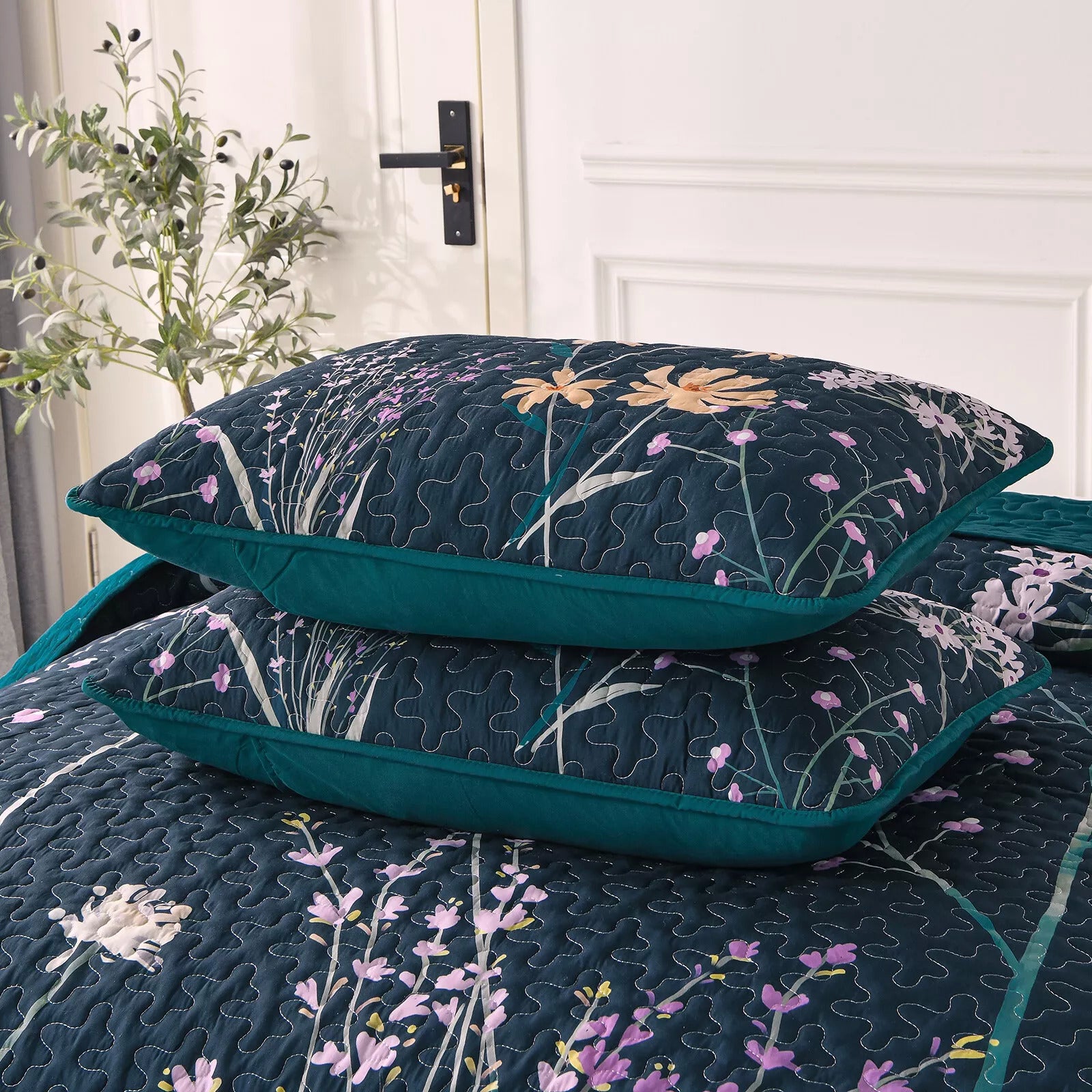 Abstract Quilted coverlet and pillowcovers set: Unique and Artistic - Queen size with floral pattern on dark background in bedroom setting