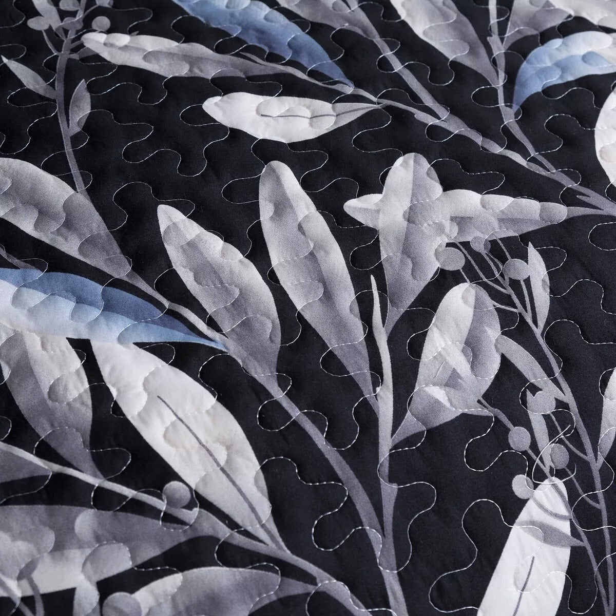 Close-up of black and gray leaf pattern fabric in Whimsical Quilted bedspread and pillowcovers set: Add Fun to Your Space - Queen size