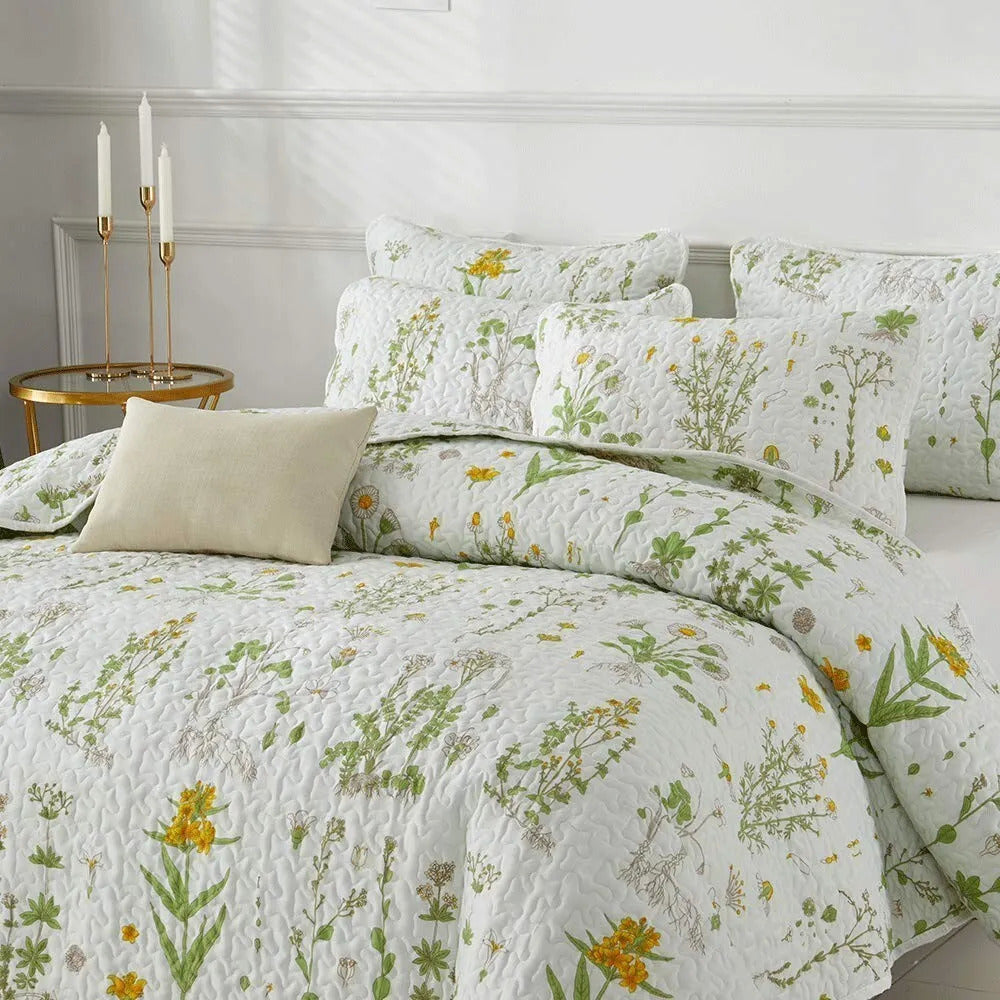 Artistic Quilted coverlet and pillowcovers set: Unleash Your Creativity - Queen size on bed with floral pattern and beige pillow