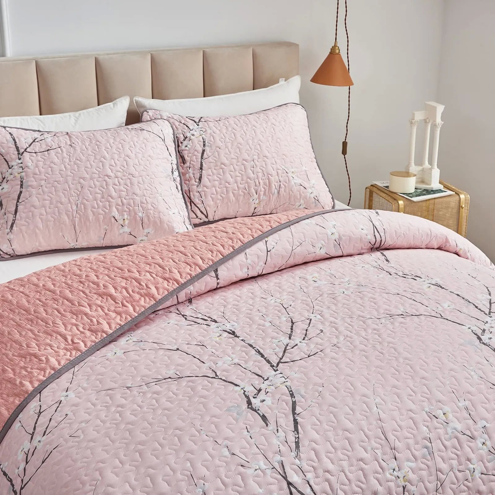 Versatile Quilted Coverlet and Pillowcases Set: Adapts to Every Season - Queen size with pink floral quilt and pillows on bed