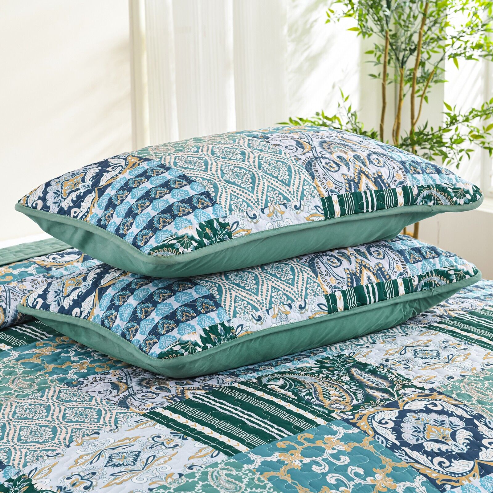 Exquisite Regal Purple 3 Pc Bedspread & Pillow Cover Set with patterned pillows stacked on matching quilt in sunlit room