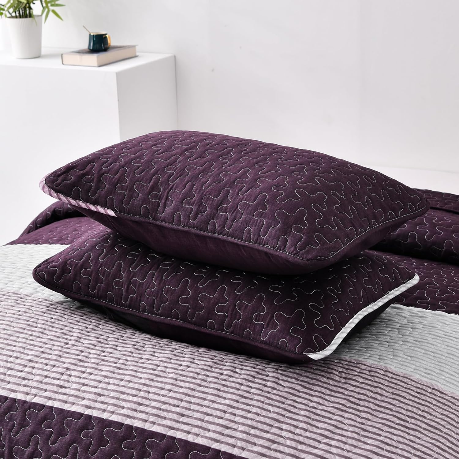Radiant Quilted coverlet and pillowcovers set: Brighten Any Room - Queen size in deep purple with textured stitching on bed by Bedzy