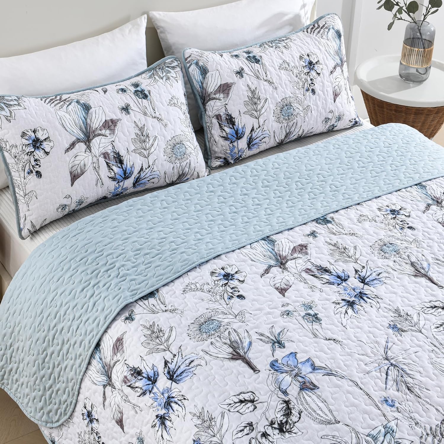 Yearning Quilted coverlet and pillowcovers set: For a Better Night's Sleep - Queen size with floral pattern and textured light blue reverse.