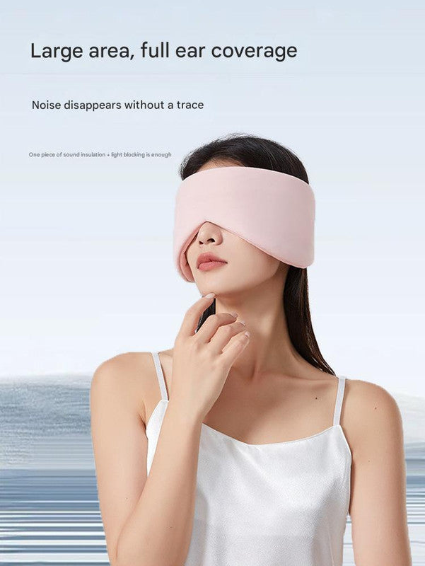 Pink Reversible All-Season Sleep Mask - Cooling & Warming with Sound Muffling Ear Covers worn by woman in white satin top