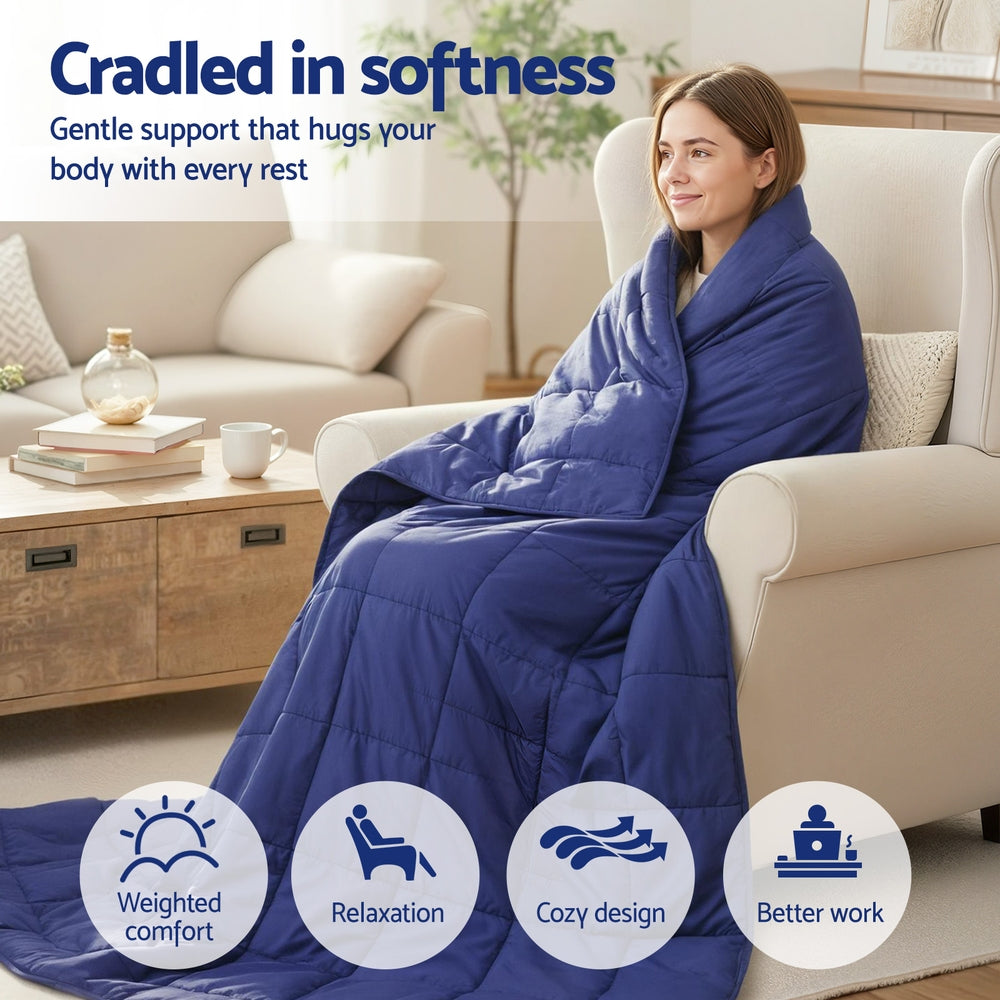 Woman wrapped in Weighted Blanket 9KG Kids Adults Heavy Gravity Relax Calm Blue sitting on armchair in cozy living room
