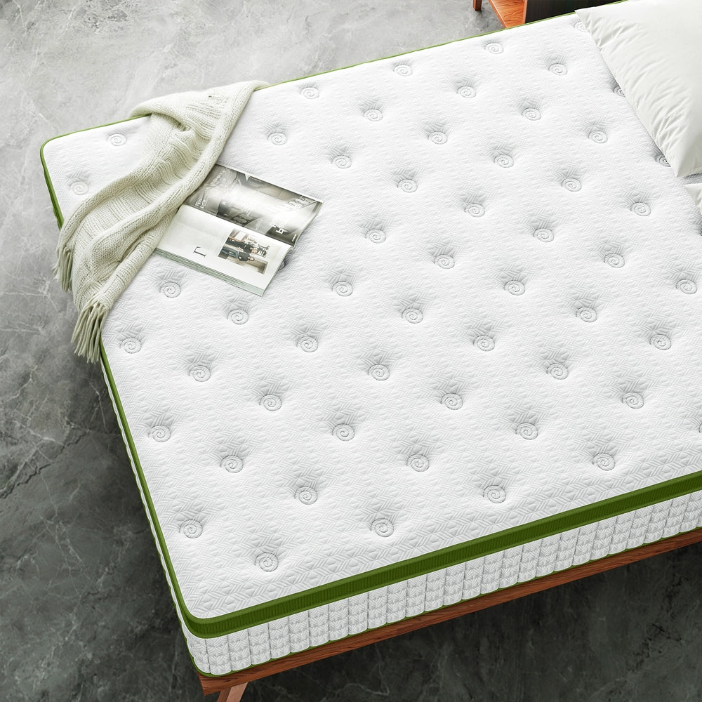 Pure Comfort Hybrid Euro Top Mattress 34cm Thick - King with white textured surface, green edge, and light bedding on gray floor