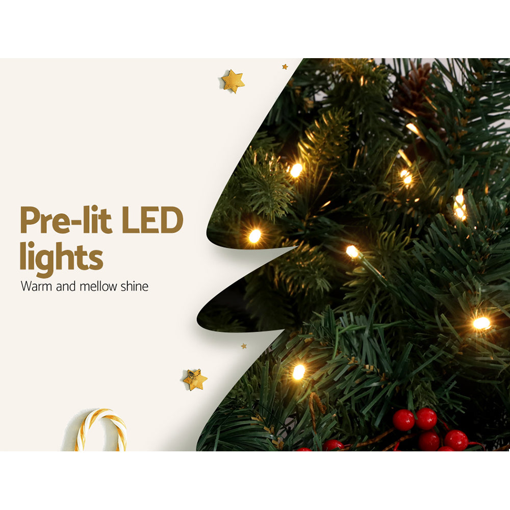 Close-up of warm white LED lights on the 2.4m Christmas Garland with LED Lights Decorations Xmas Party showing green foliage and red berries