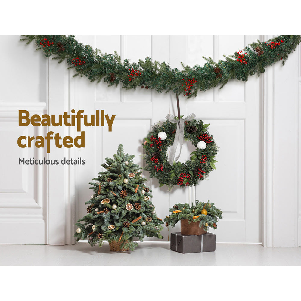2.4m Christmas Garland with LED Lights Decorations Xmas Party draped above festive wreath and decorated mini Christmas trees