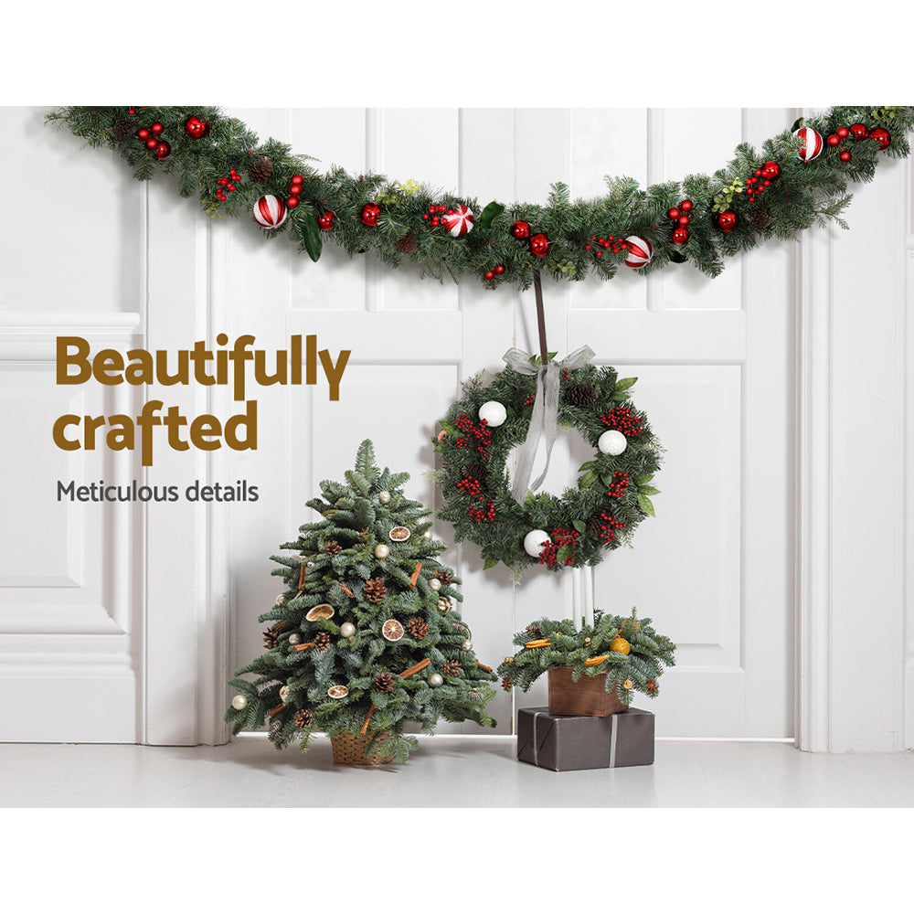 2.7m Christmas Garland with Decorations Xmas Wedding Party draped above matching wreath and tabletop trees with festive details