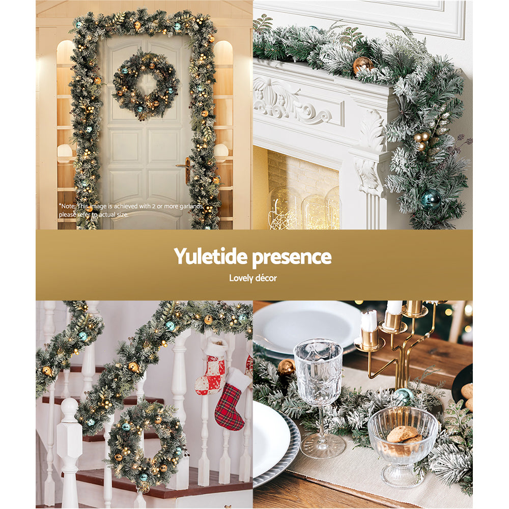 2.7m Christmas Garland with LED Lights Snowy Decoration Xmas Party shown draped over door, mantel, staircase, and table centerpiece with ornaments.