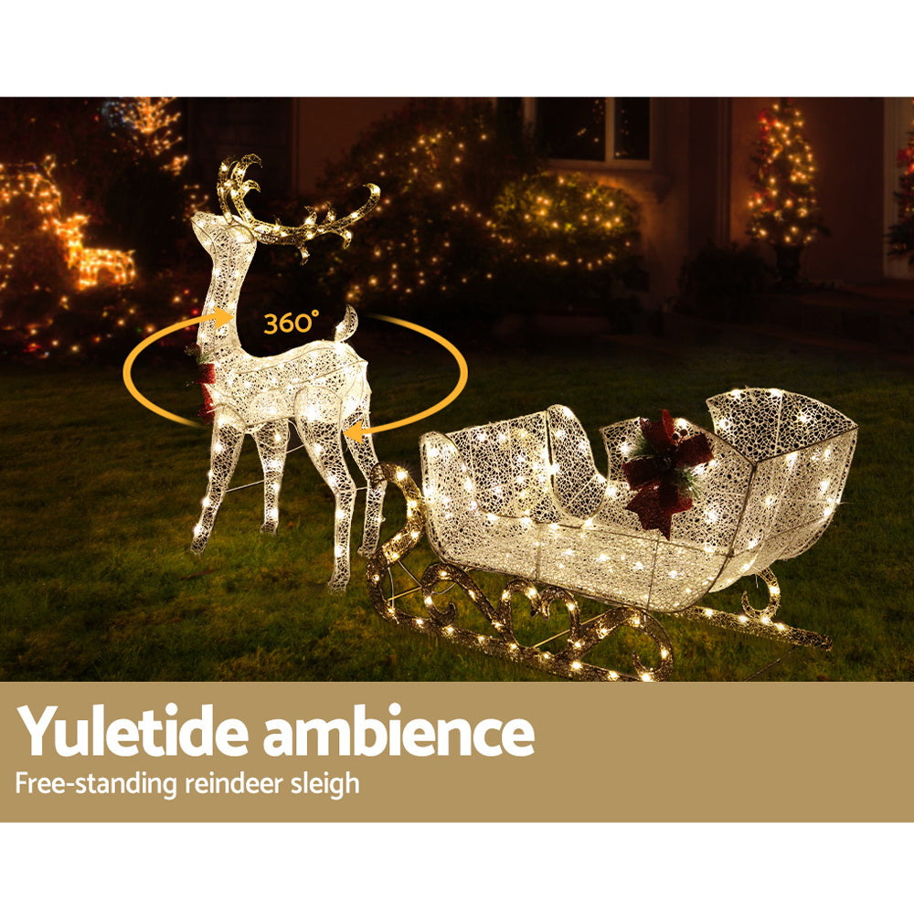215 LED Christmas Lights Reindeer Sleigh Decorations with warm white lights, creating festive outdoor holiday ambiance at night