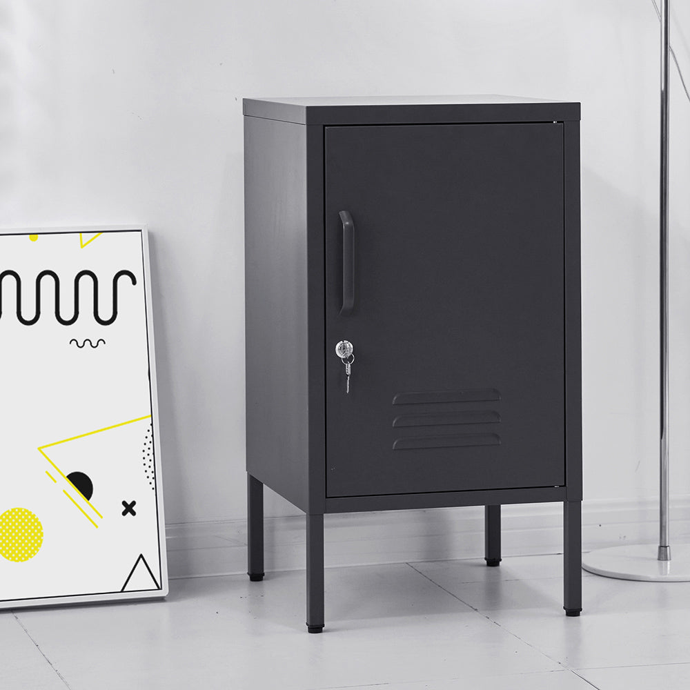 Bedside Table Metal Cabinet - Black with lockable door, metal locker design, and slim elevated legs on white floor background