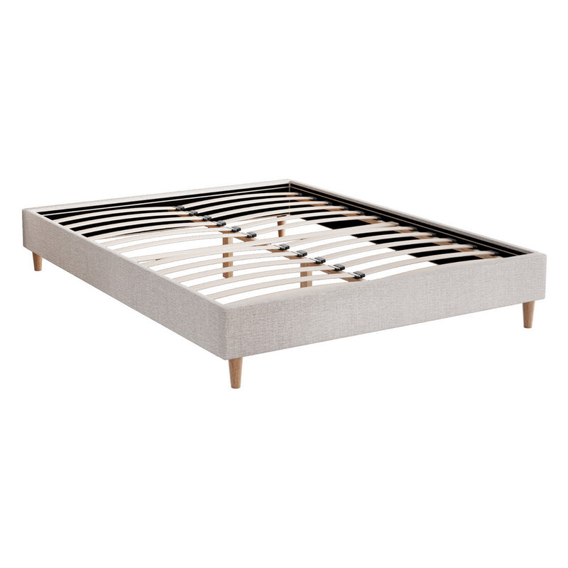 Zora Double Bed Frame Base Beige with solid wood slats and tapered wooden legs for durable bedroom furniture by Bedzy