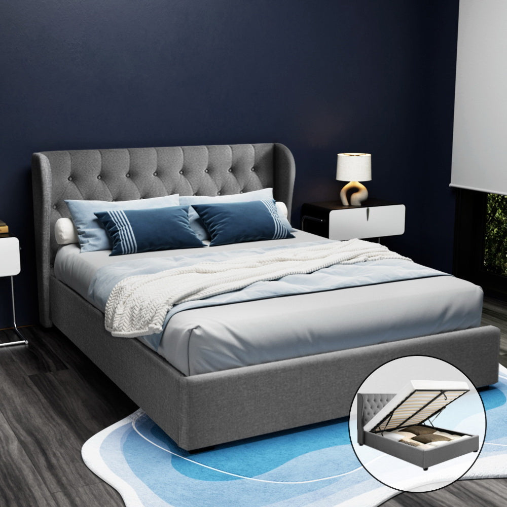Elouera Queen Bed Frame With Gas Lift Storage Grey in bedroom setting with tufted headboard and blue bedding
