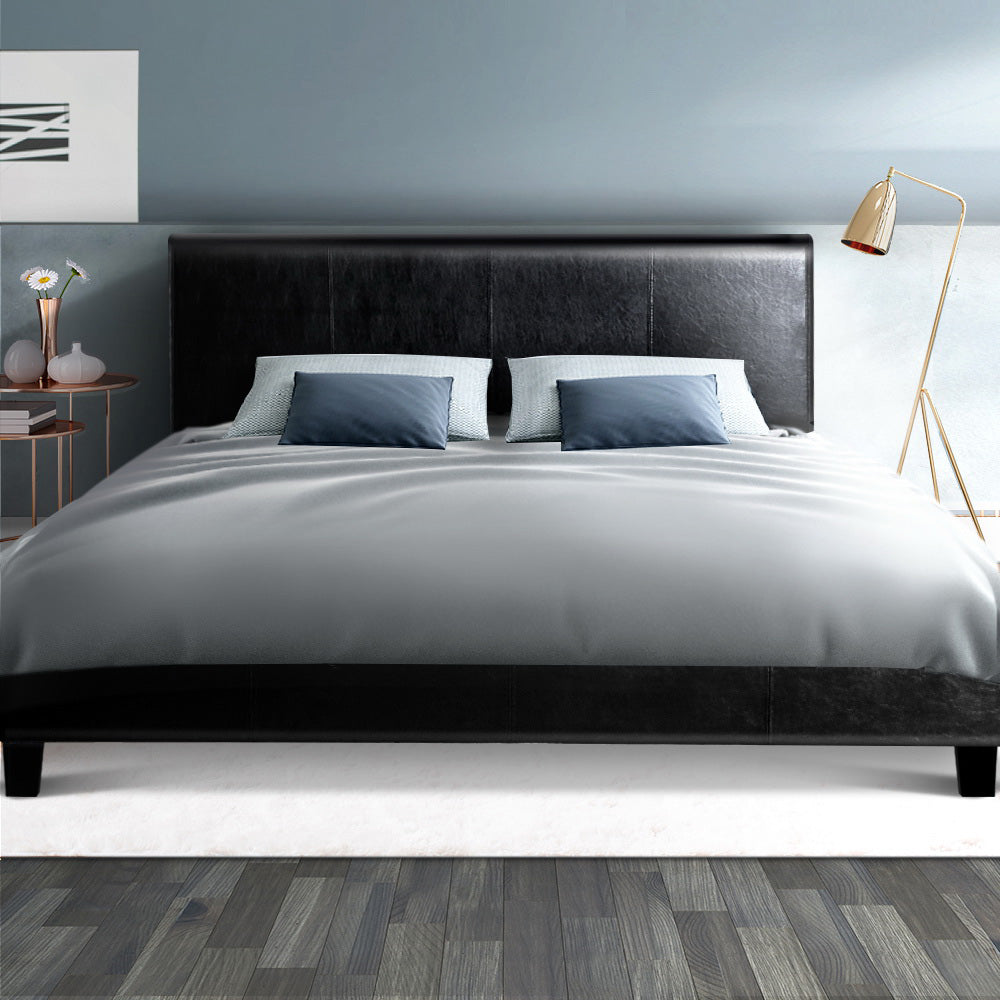 Coogee Double Bed Frame Black with sleek PVC leather upholstery, modern design, and sturdy wooden legs in a bedroom setting