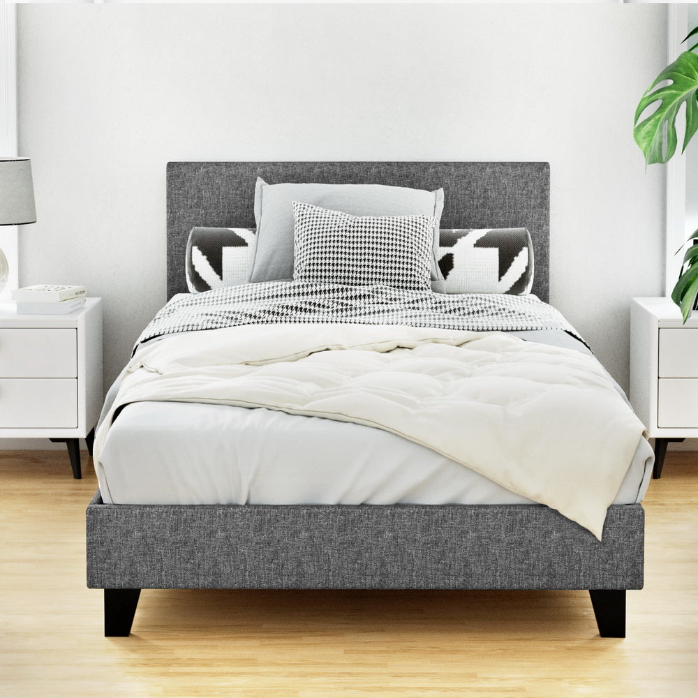 Coogee King Single Bed Frame Grey with upholstered headboard, wooden legs, and cozy bedding in a modern bedroom setting