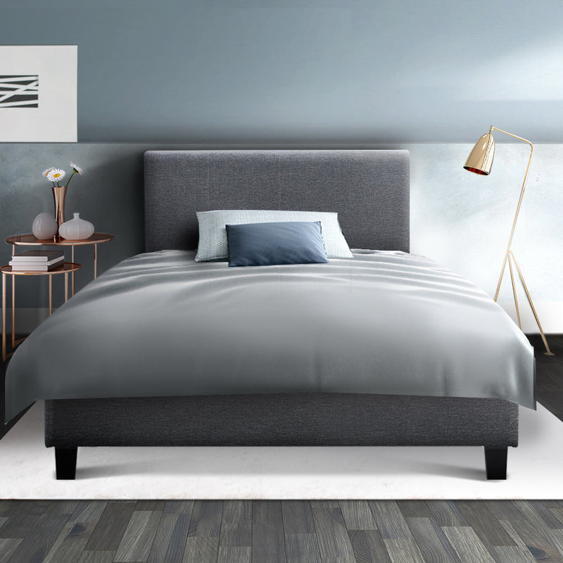 Coogee King Single Bed Frame Grey with upholstered headboard, wooden legs, and soft grey bedding in a modern bedroom setting