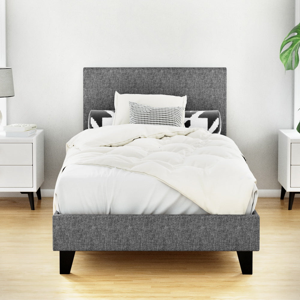 Coogee Single Bed Frame Grey with premium faux linen fabric, modern design, and black wooden legs in bedroom setting