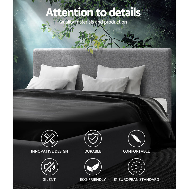 Elwood Gas Lift Storage Double Bed Frame Grey with grey upholstered headboard and white pillows in bedroom setting