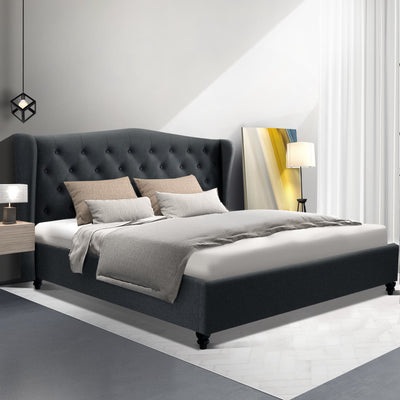 Altona King Bed Frame Charcoal with tufted wing headboard, upholstered base, and neutral bedding in modern bedroom setting