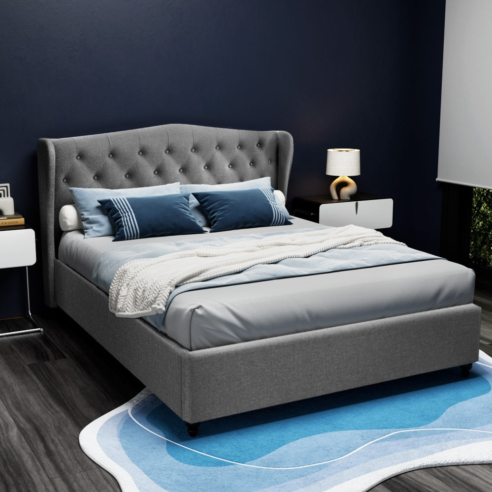 Altona Queen Bed Frame Grey with tufted wingback headboard, upholstered in grey fabric, styled in modern bedroom setting